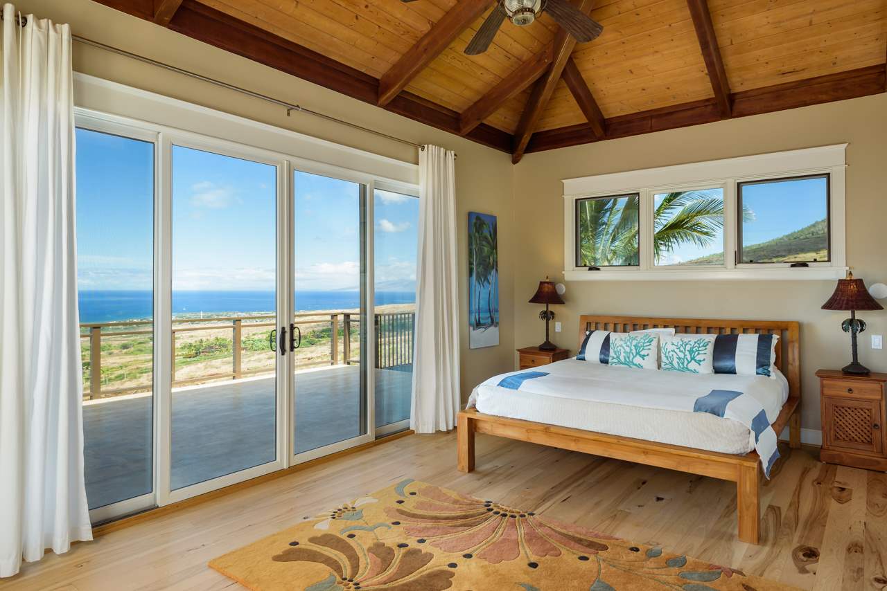 554 Punakea Loop Lahaina, HI 96761 - Photo 19 of 30 a bedroom with a bed and large window
