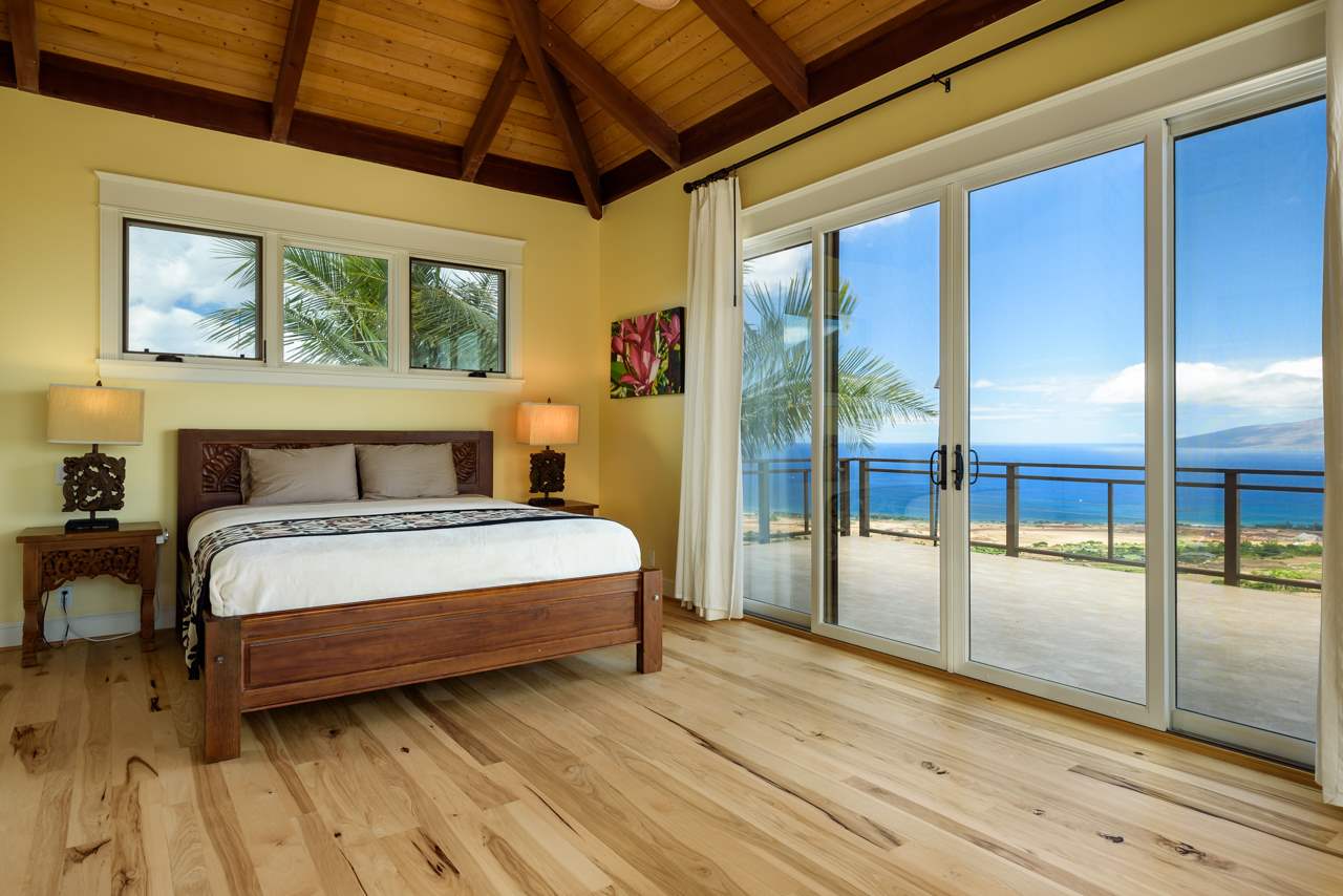 554 Punakea Loop Lahaina, HI 96761 - Photo 20 of 30 a bedroom with a large bed and a large window