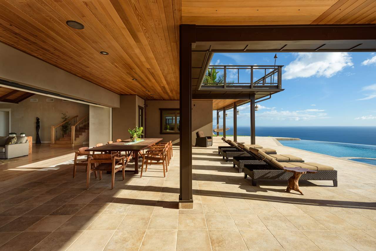 554 Punakea Loop Lahaina, HI 96761 - Photo 22 of 30 a view of a patio with table and chairs next to a yard