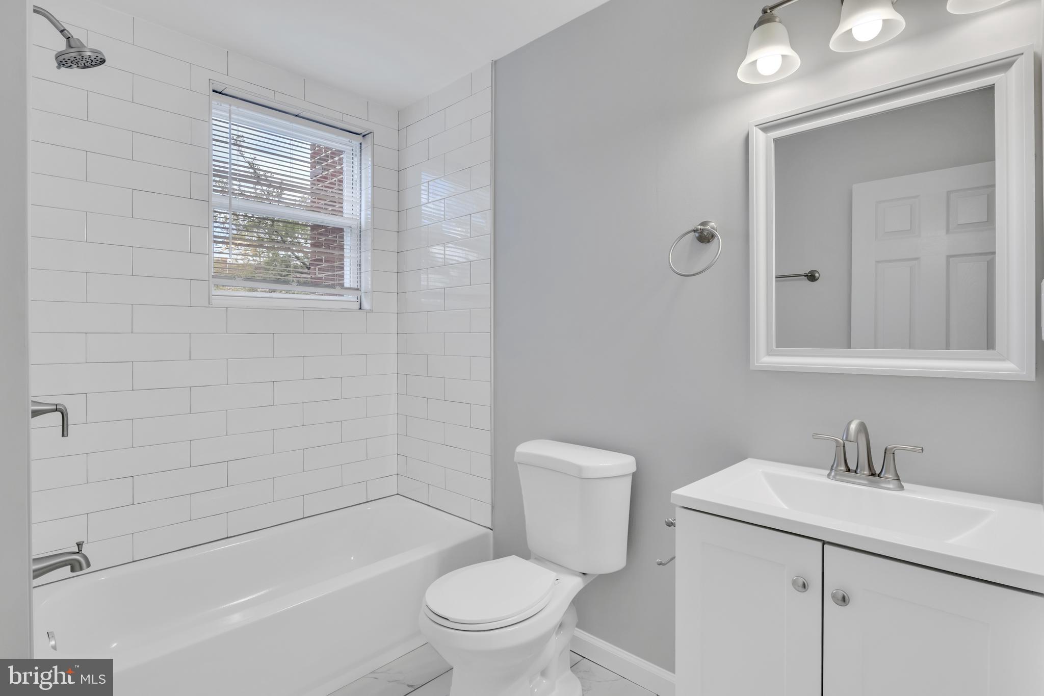 4437 Old York Road Baltimore, MD 21212 - Photo 12 of 15 a bathroom with a sink toilet and shower