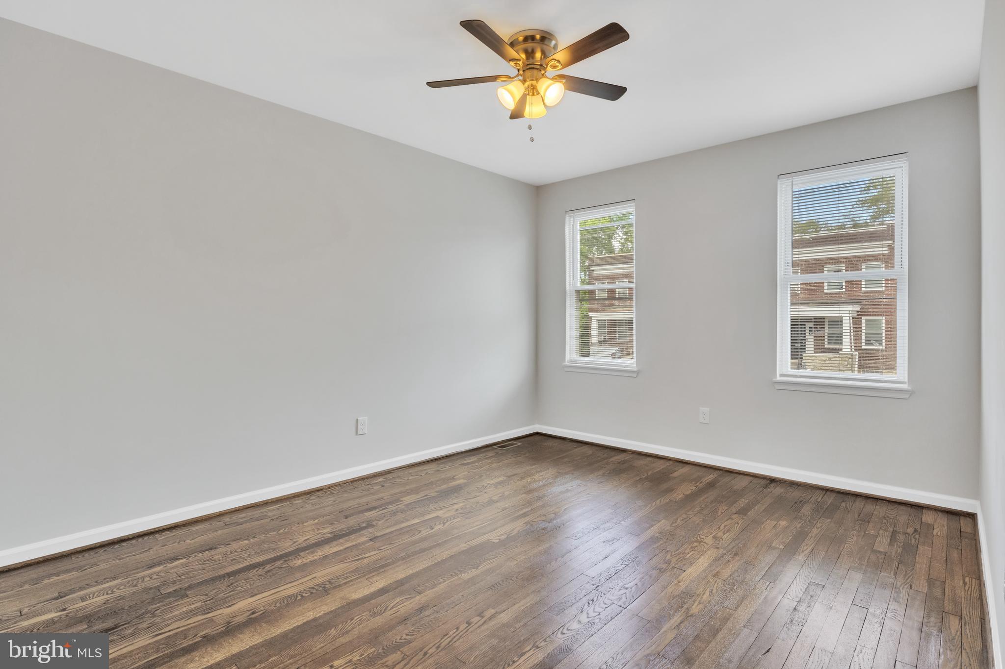 4437 Old York Road Baltimore, MD 21212 - Photo 13 of 15 a view of a room with wooden floor and a window