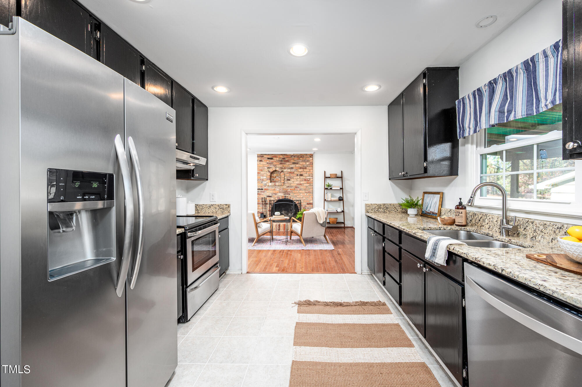 5215 Pelham Road Durham, NC 27713 - Photo 12 of 45 a large kitchen with stainless steel appliances lots of counter top space