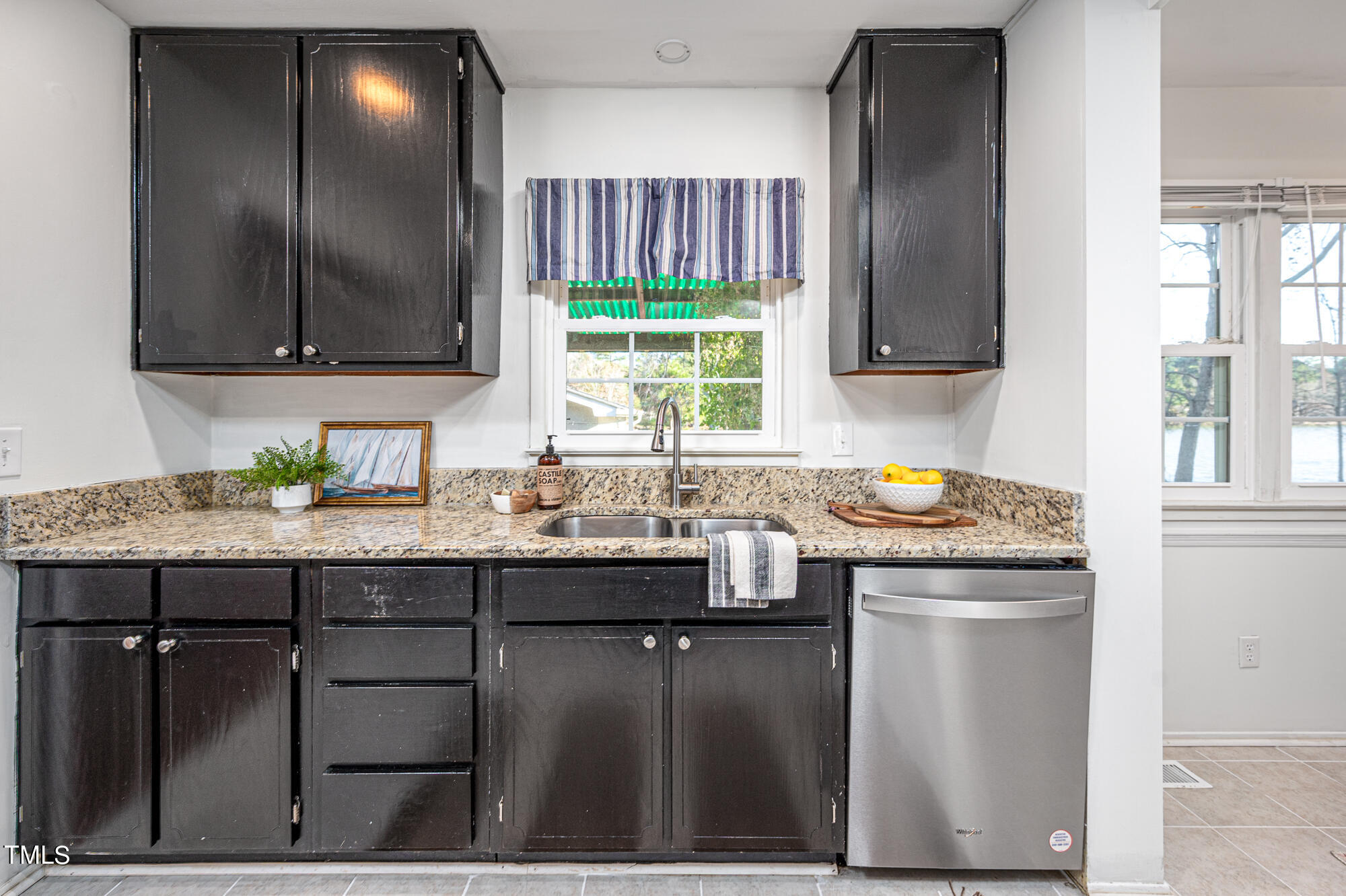 5215 Pelham Road Durham, NC 27713 - Photo 13 of 45 a kitchen with granite countertop a sink and a window