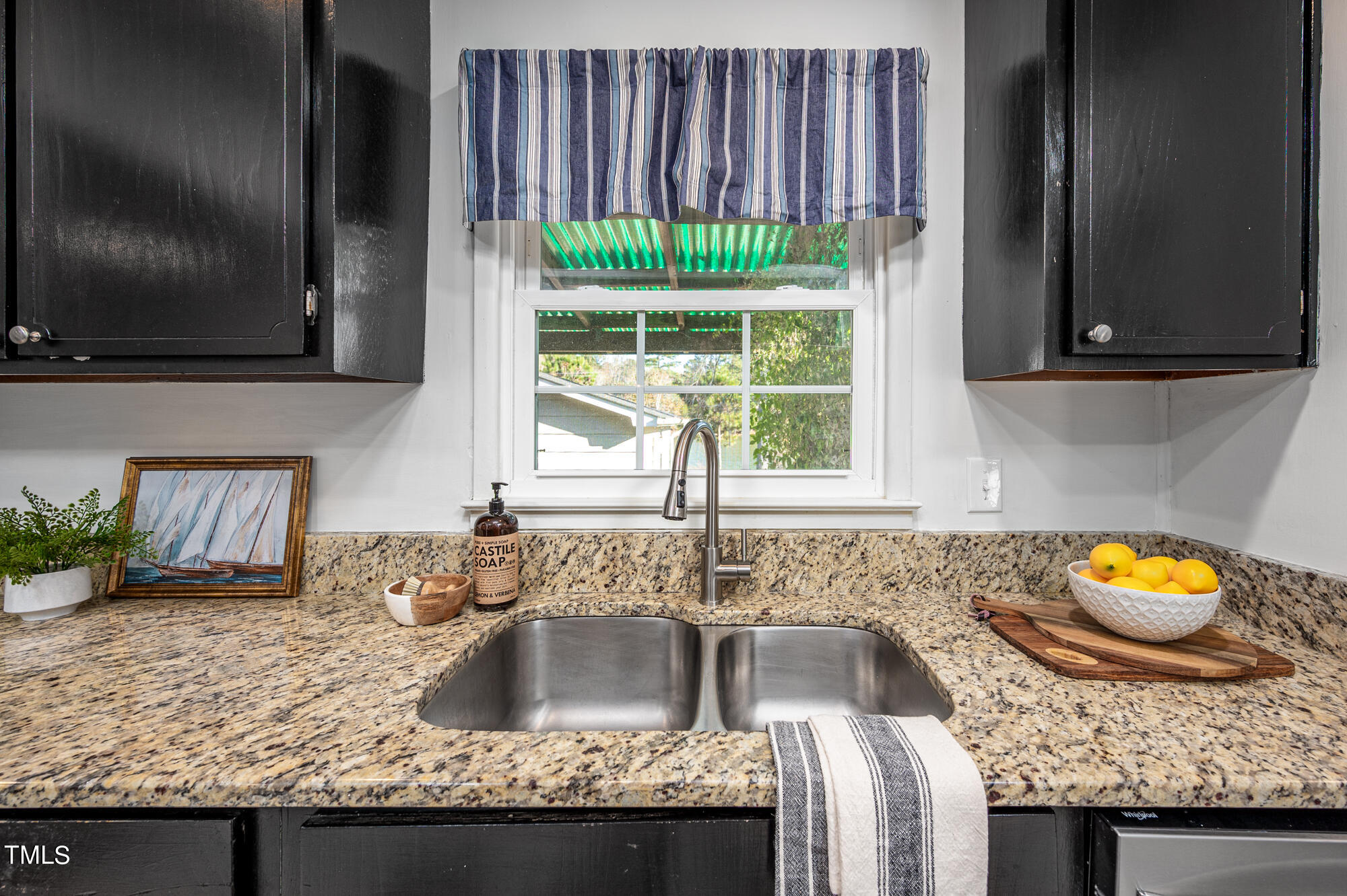 5215 Pelham Road Durham, NC 27713 - Photo 14 of 45 a kitchen with granite countertop a sink and a stove