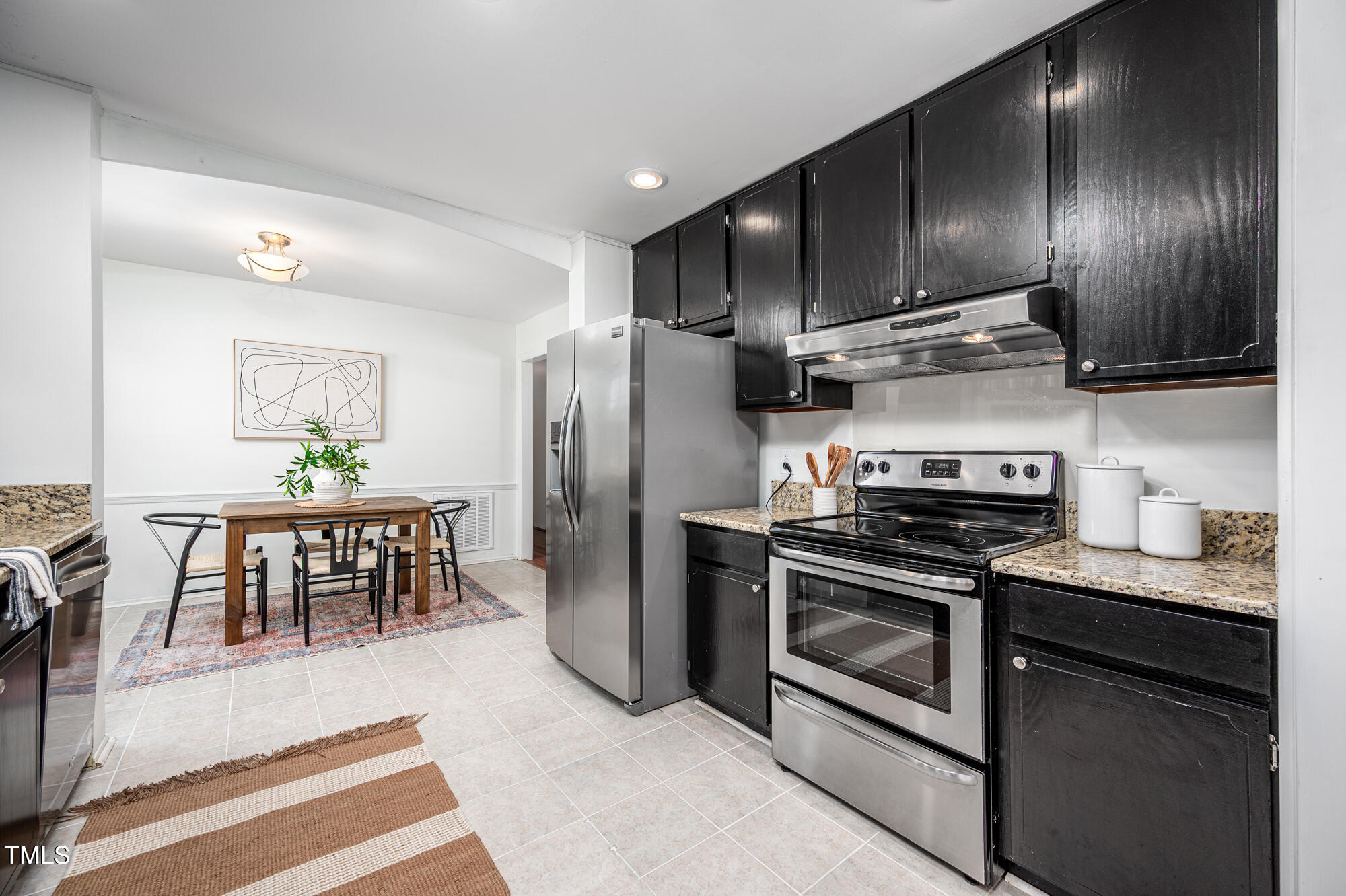 5215 Pelham Road Durham, NC 27713 - Photo 15 of 45 a kitchen with stainless steel appliances granite countertop a stove a refrigerator and a refrigerator
