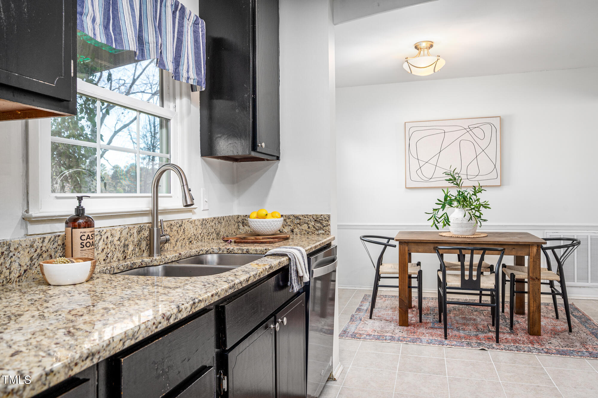 5215 Pelham Road Durham, NC 27713 - Photo 16 of 45 a kitchen with sink and view of living room