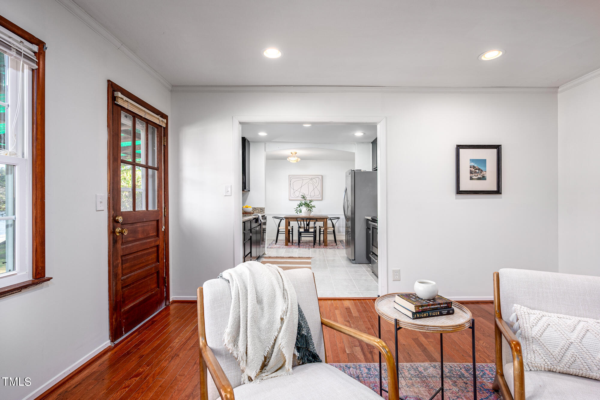 5215 Pelham Road Durham, NC 27713 - Photo 20 of 45 a living room with furniture and a wooden floor
