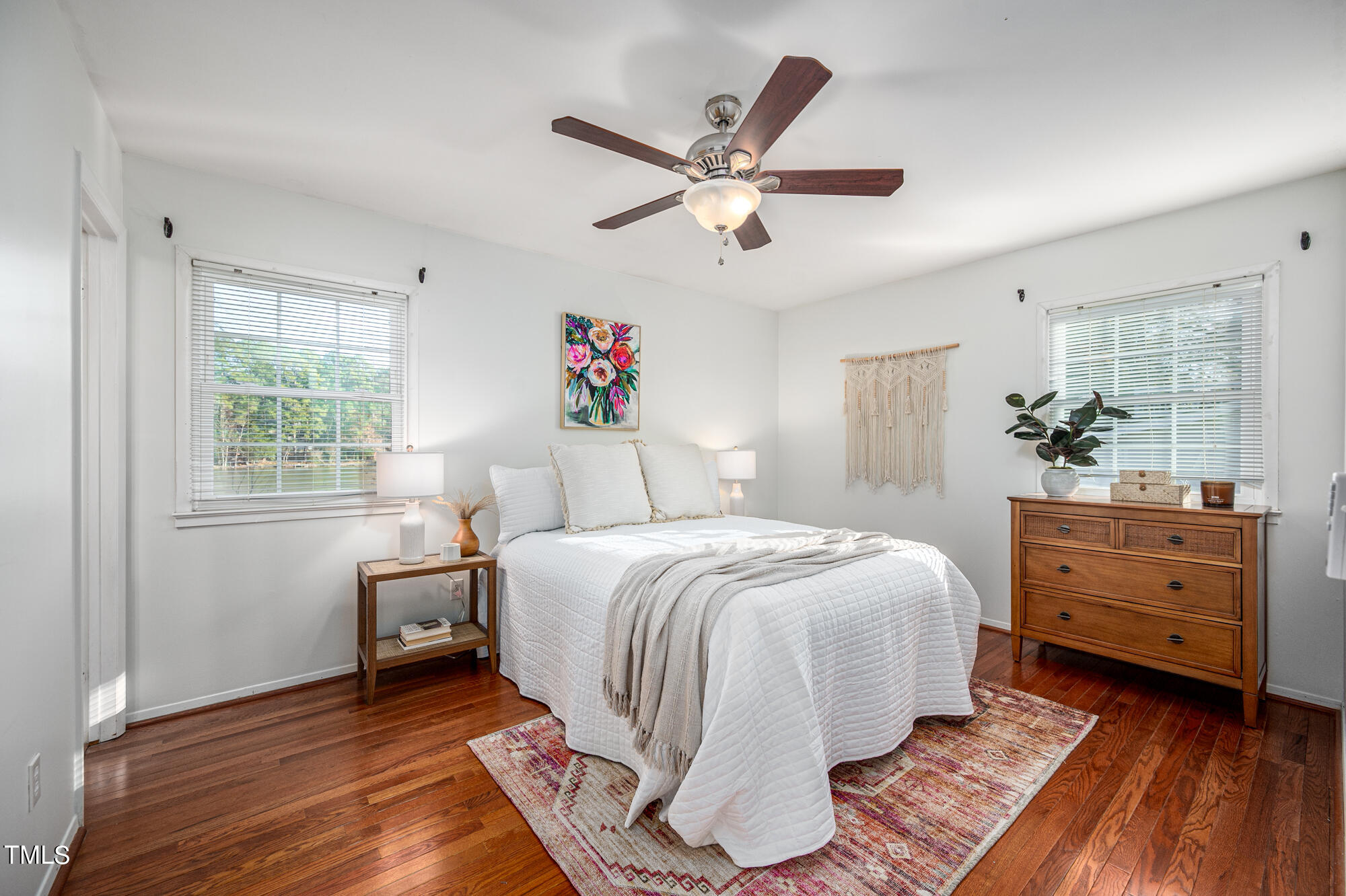5215 Pelham Road Durham, NC 27713 - Photo 26 of 45 a spacious bedroom with a bed and a dresser