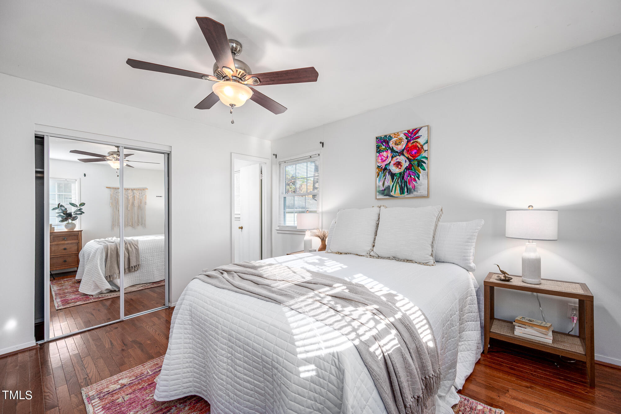 5215 Pelham Road Durham, NC 27713 - Photo 27 of 45 a bedroom with a bed and a chandelier