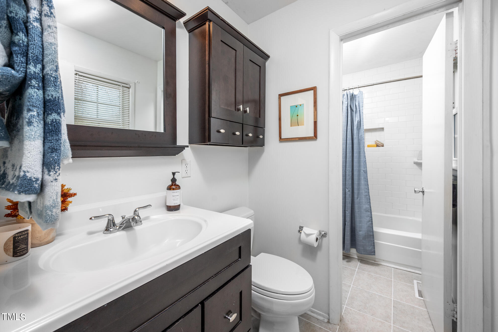 5215 Pelham Road Durham, NC 27713 - Photo 29 of 45 a bathroom with a sink toilet and vanity
