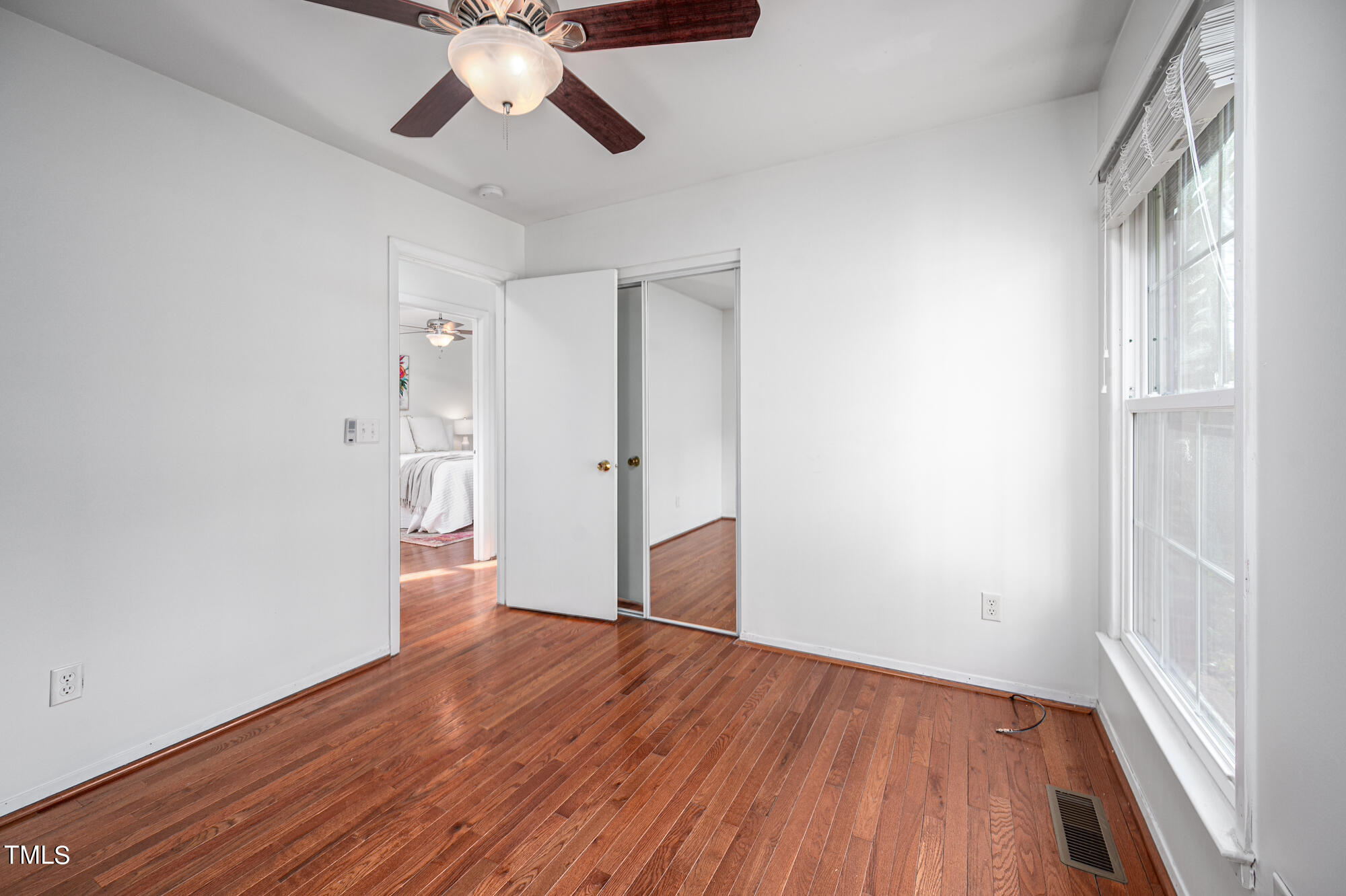5215 Pelham Road Durham, NC 27713 - Photo 31 of 45 wooden floor in an empty room with a window