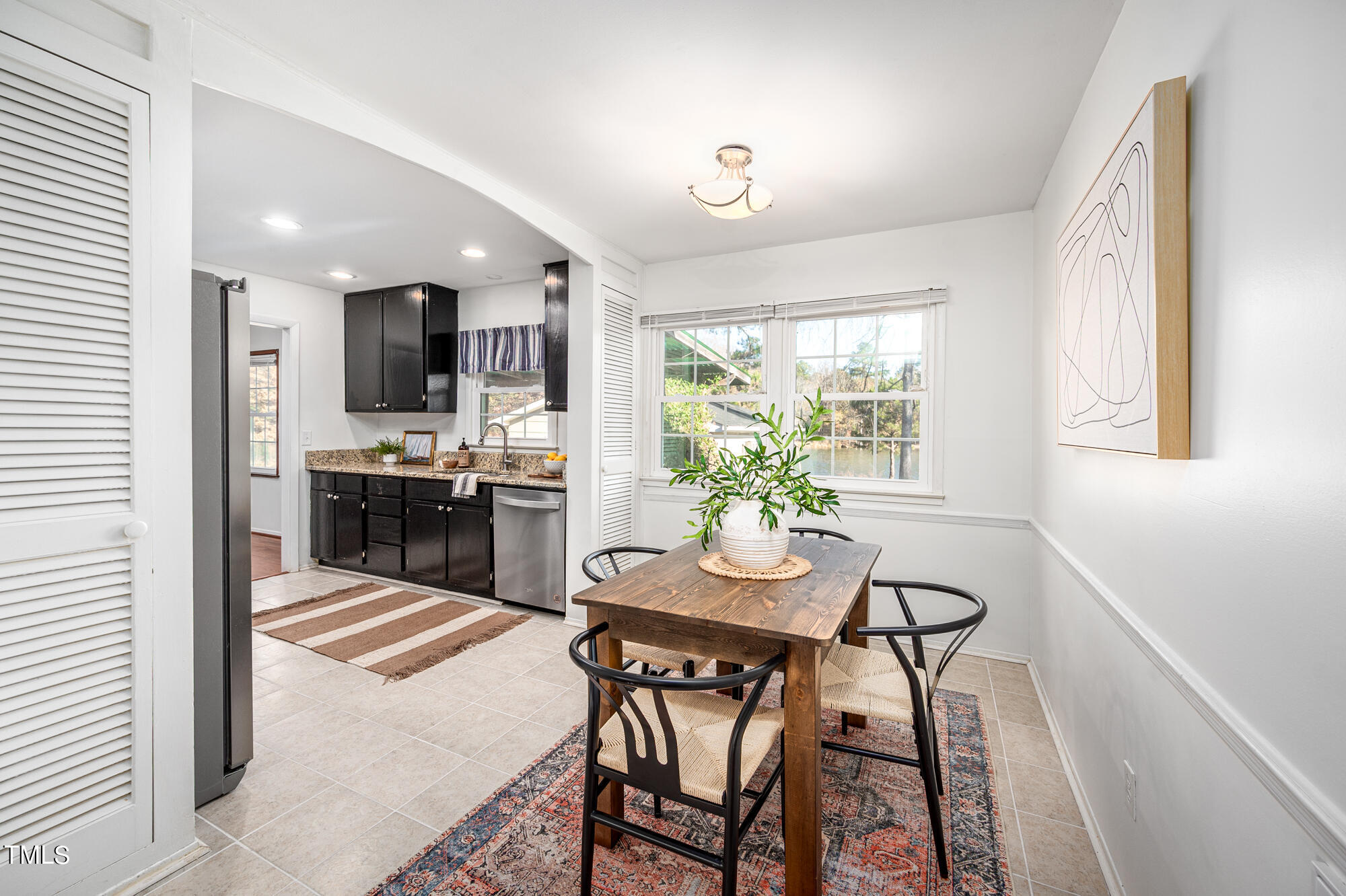 5215 Pelham Road Durham, NC 27713 - Photo 10 of 45 a view of a dining room with furniture and a window