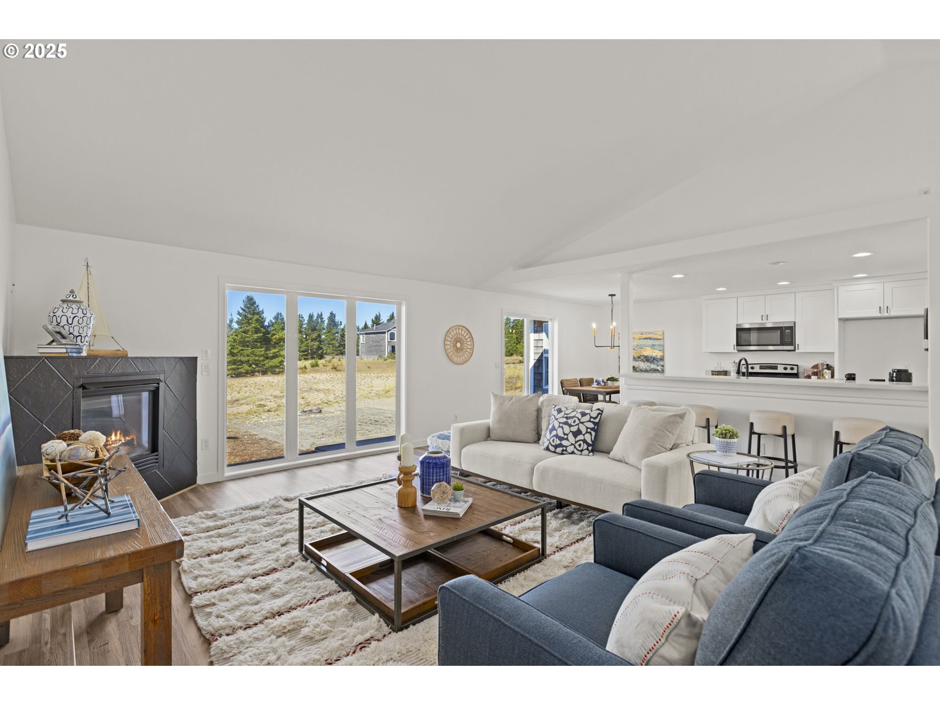 9980 Pine Ridge Drive Nehalem, OR 97131 - Photo 5 of 27 a living room with furniture and a large window
