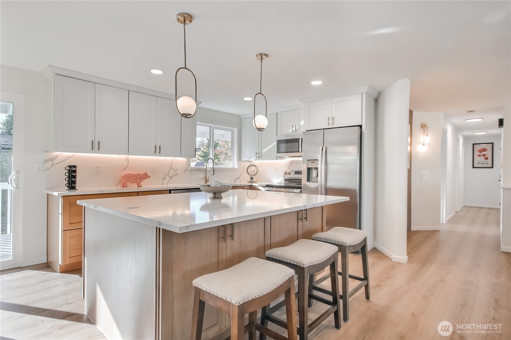 1229 Southwest 158th Street Burien, WA 98166 - Photo 12 of 40 a kitchen with kitchen island a sink stove and refrigerator