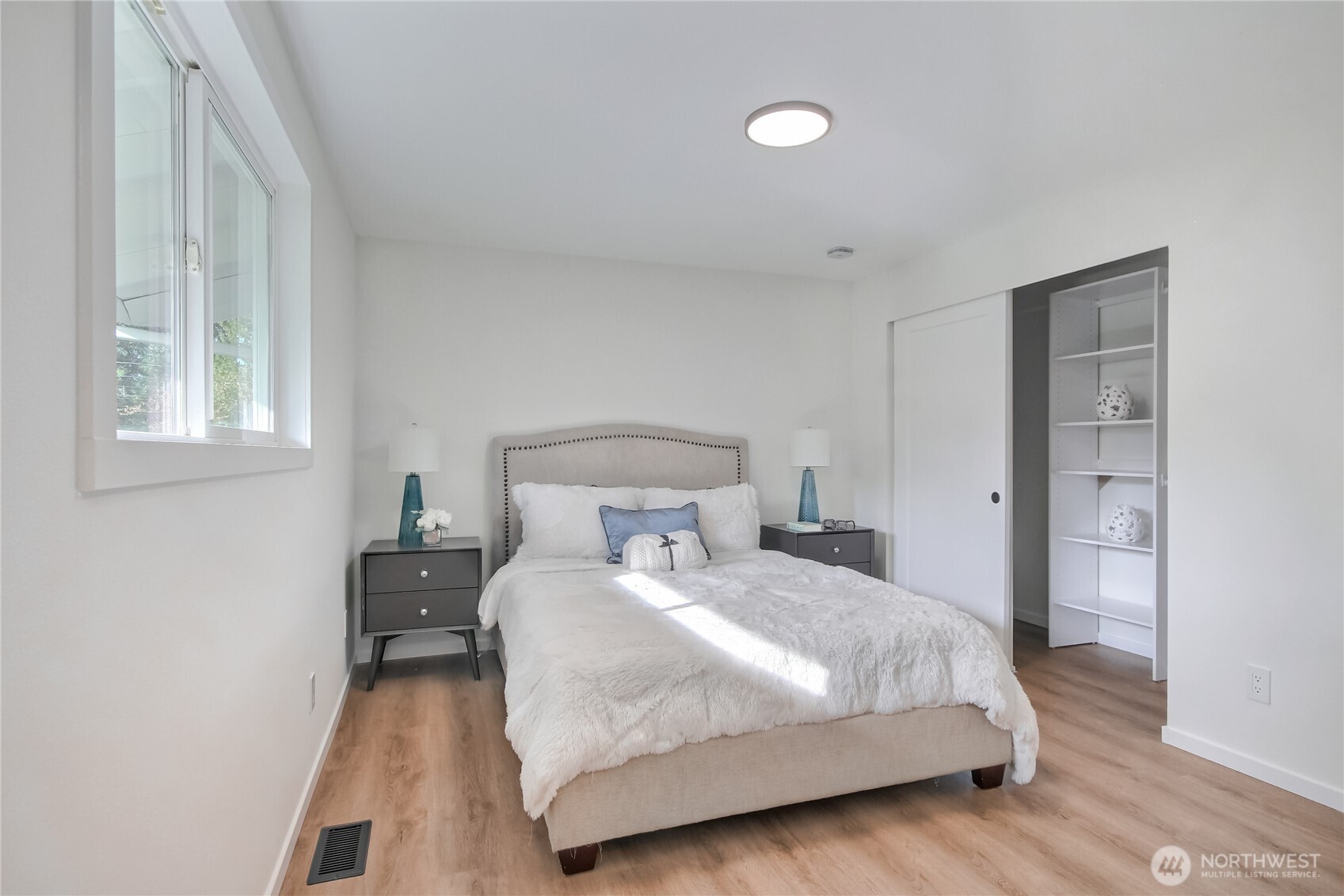 1229 Southwest 158th Street Burien, WA 98166 - Photo 15 of 40 a bedroom with a bed and a table in it