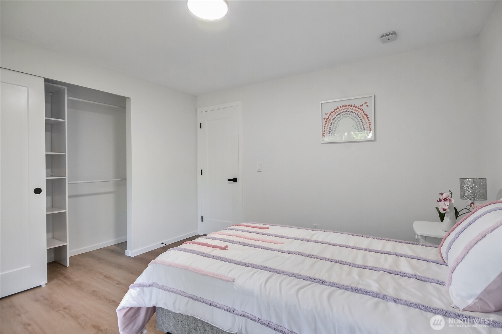 1229 Southwest 158th Street Burien, WA 98166 - Photo 21 of 40 a bedroom with a bed and wooden floor