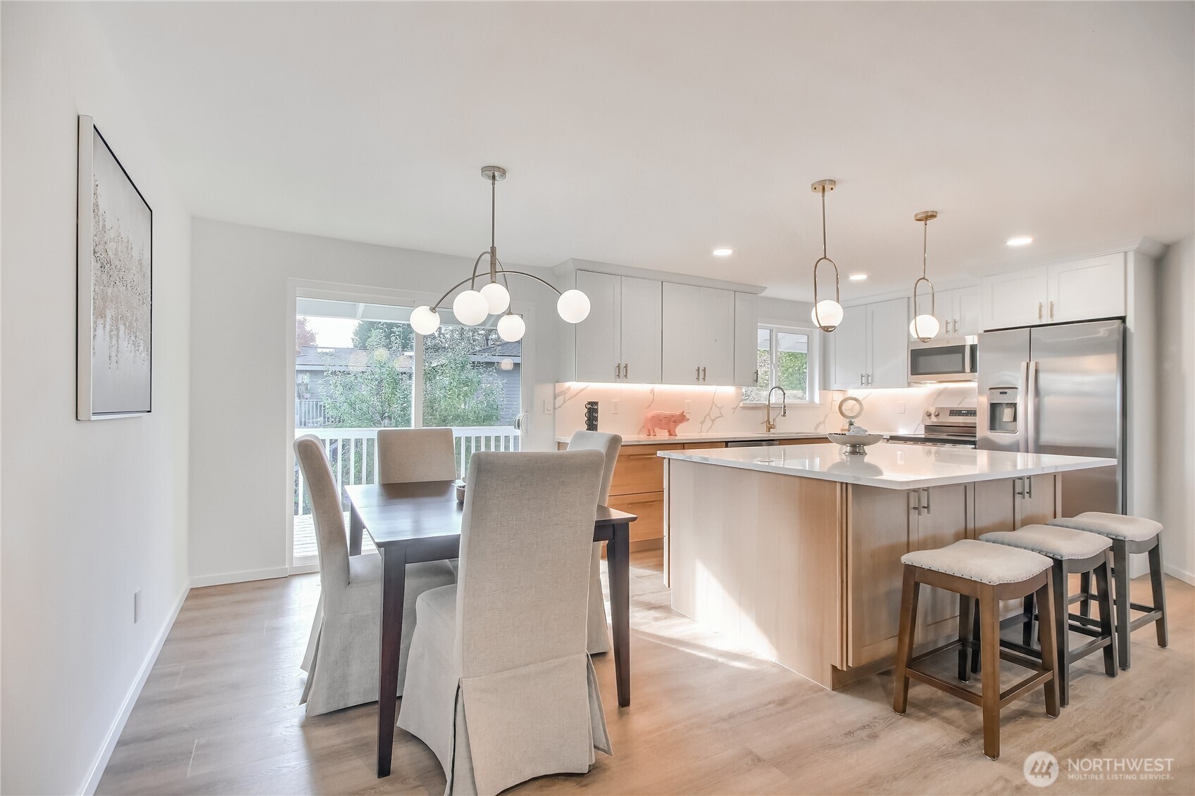 1229 Southwest 158th Street Burien, WA 98166 - Photo 10 of 40 a dining room filled chandelier and wooden floor