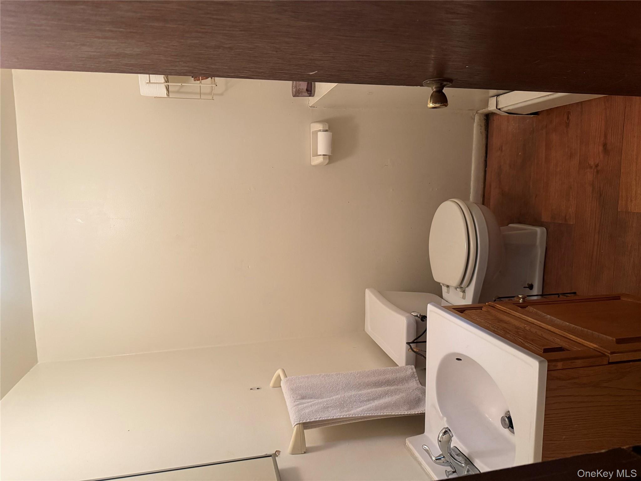 20 McGill Road Monroe, NY 10950 - Photo 11 of 11 a bathroom with a toilet a sink and mirror