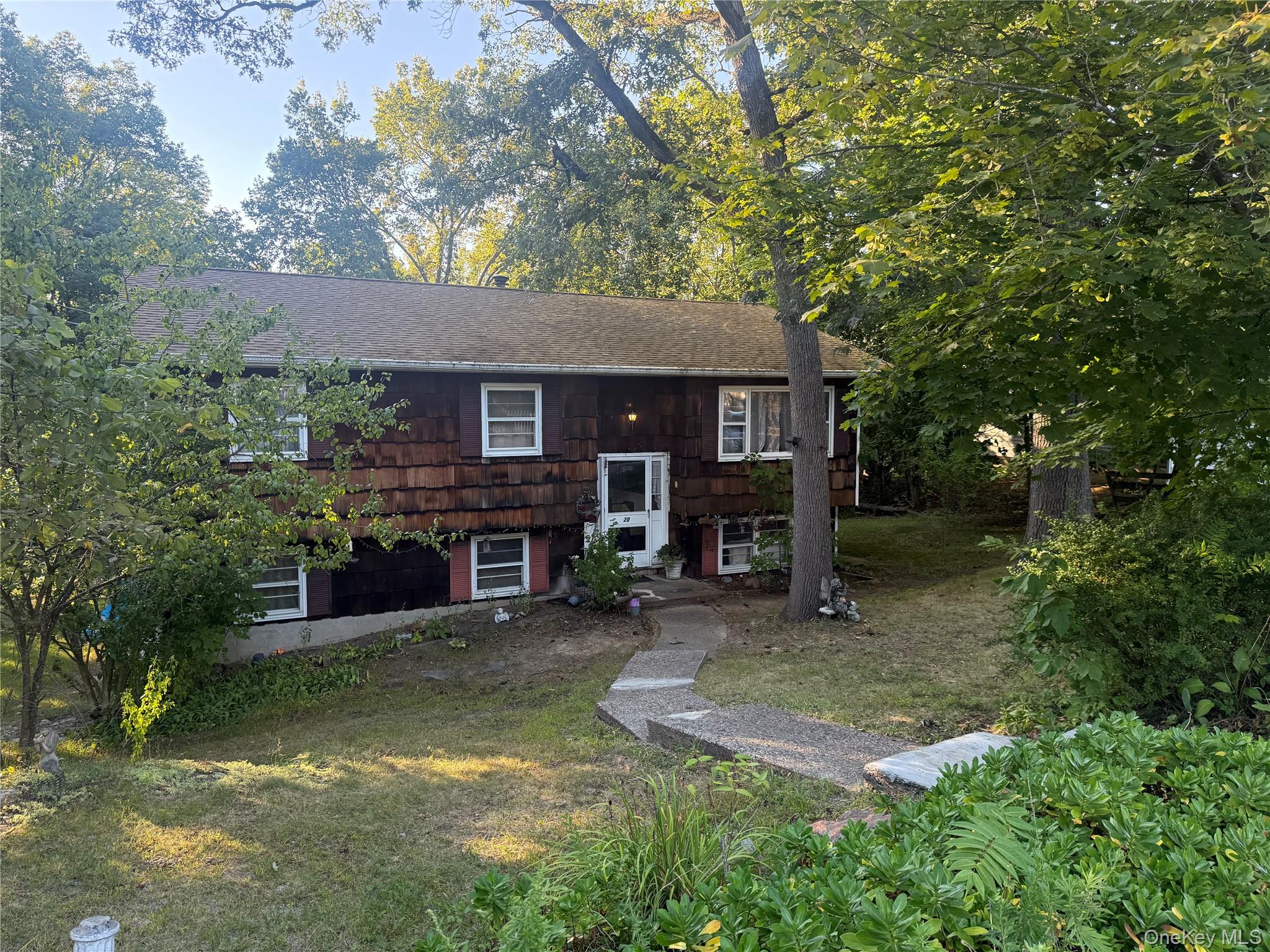 20 McGill Road Monroe, NY 10950 - Photo 2 of 11 front view of a house with a patio