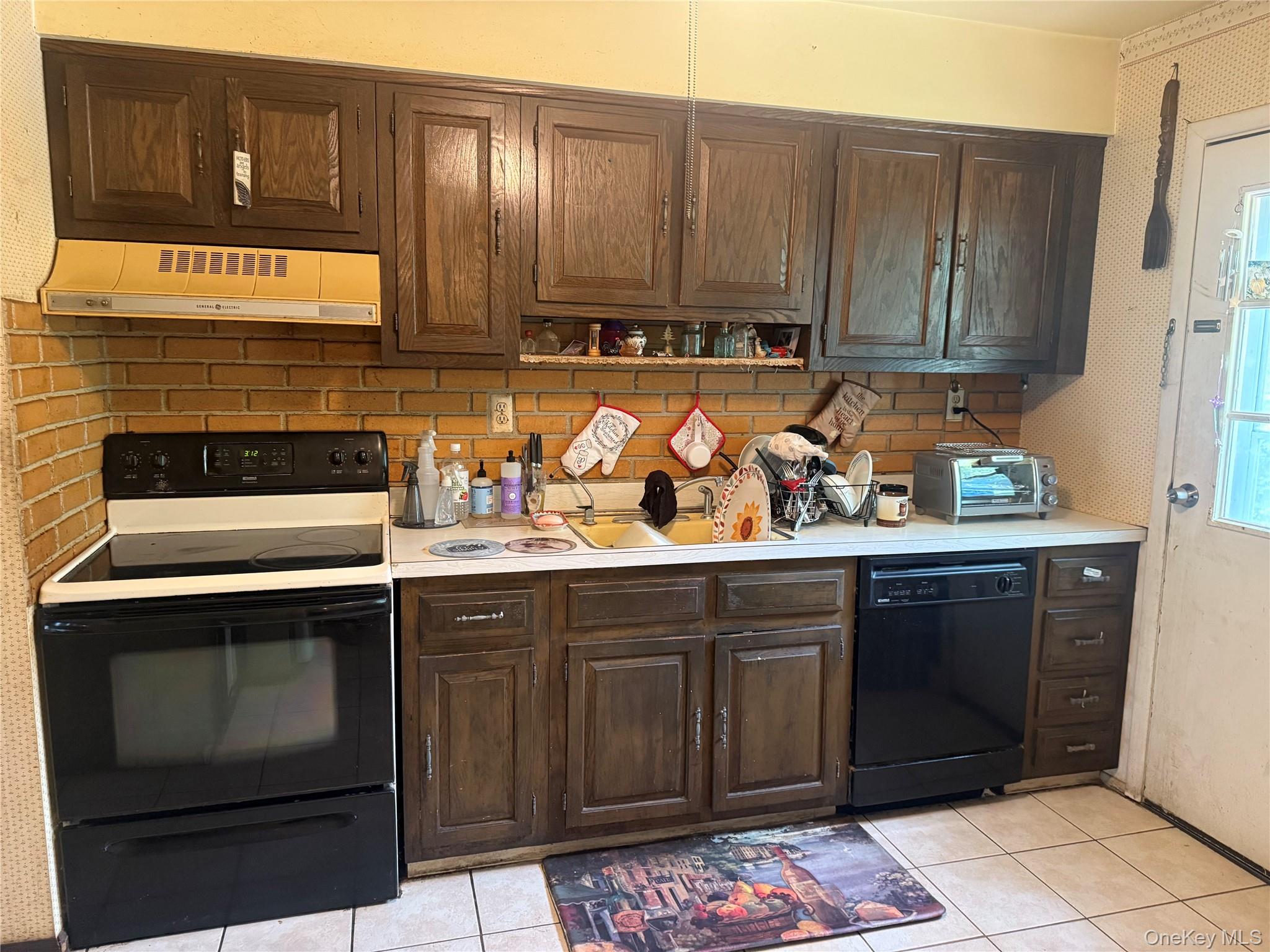 20 McGill Road Monroe, NY 10950 - Photo 4 of 11 a kitchen with stainless steel appliances granite countertop wooden cabinets and a stove top oven
