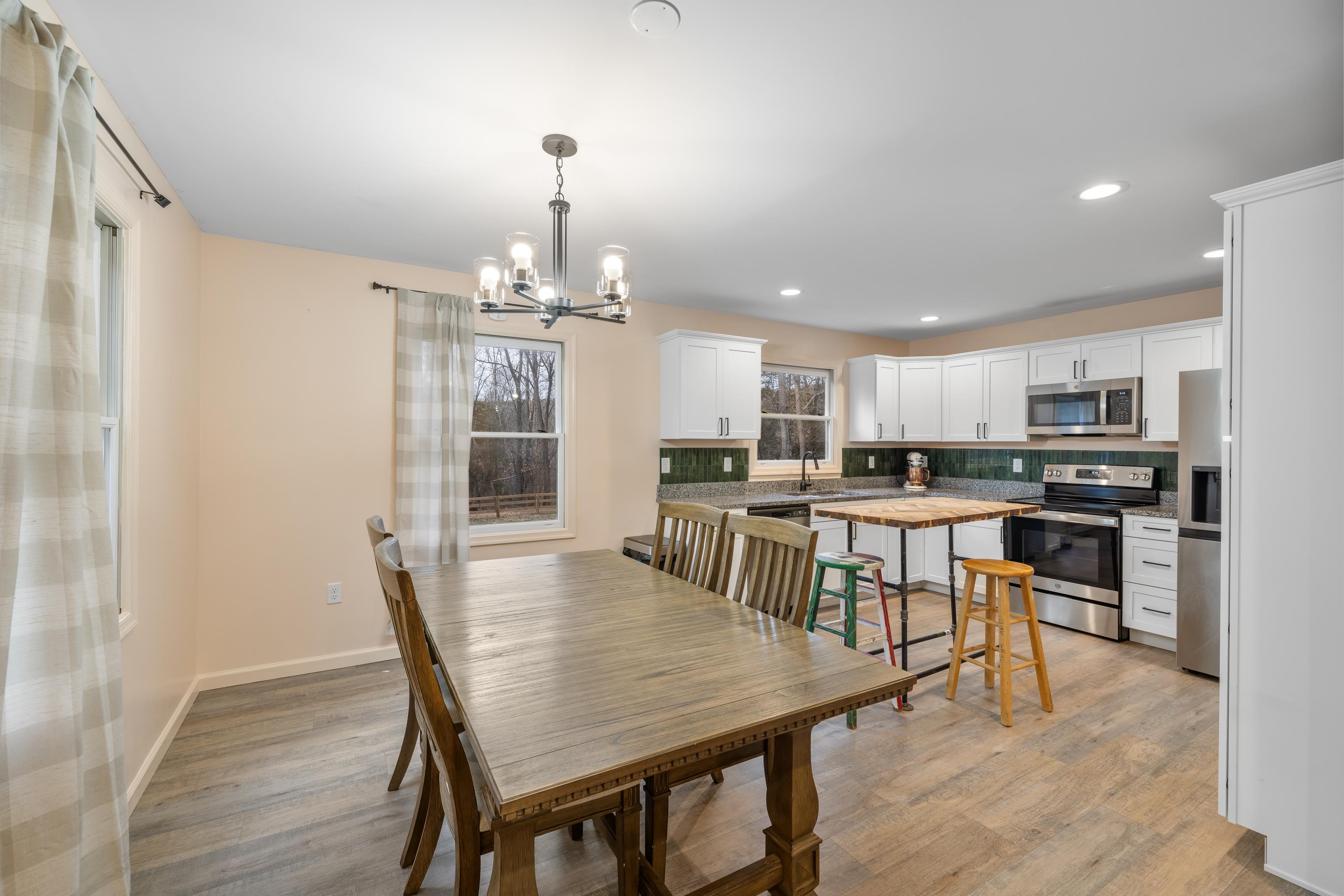 167 Raintree Road Verona, VA 24482 - Photo 12 of 75 a view of a dining room with furniture and wooden floor