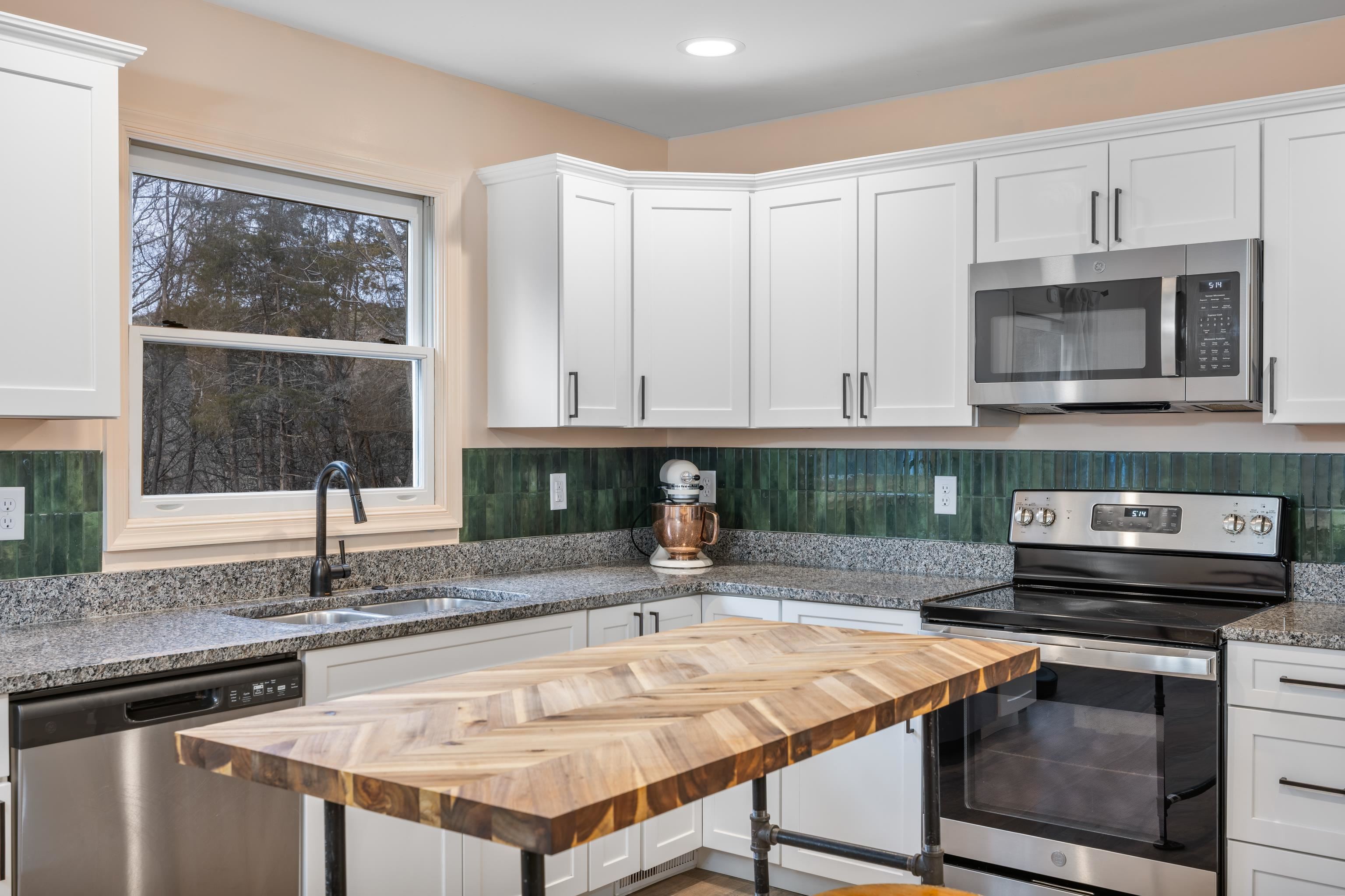167 Raintree Road Verona, VA 24482 - Photo 14 of 75 a kitchen with stainless steel appliances granite countertop a sink dishwasher and cabinets with wooden floor