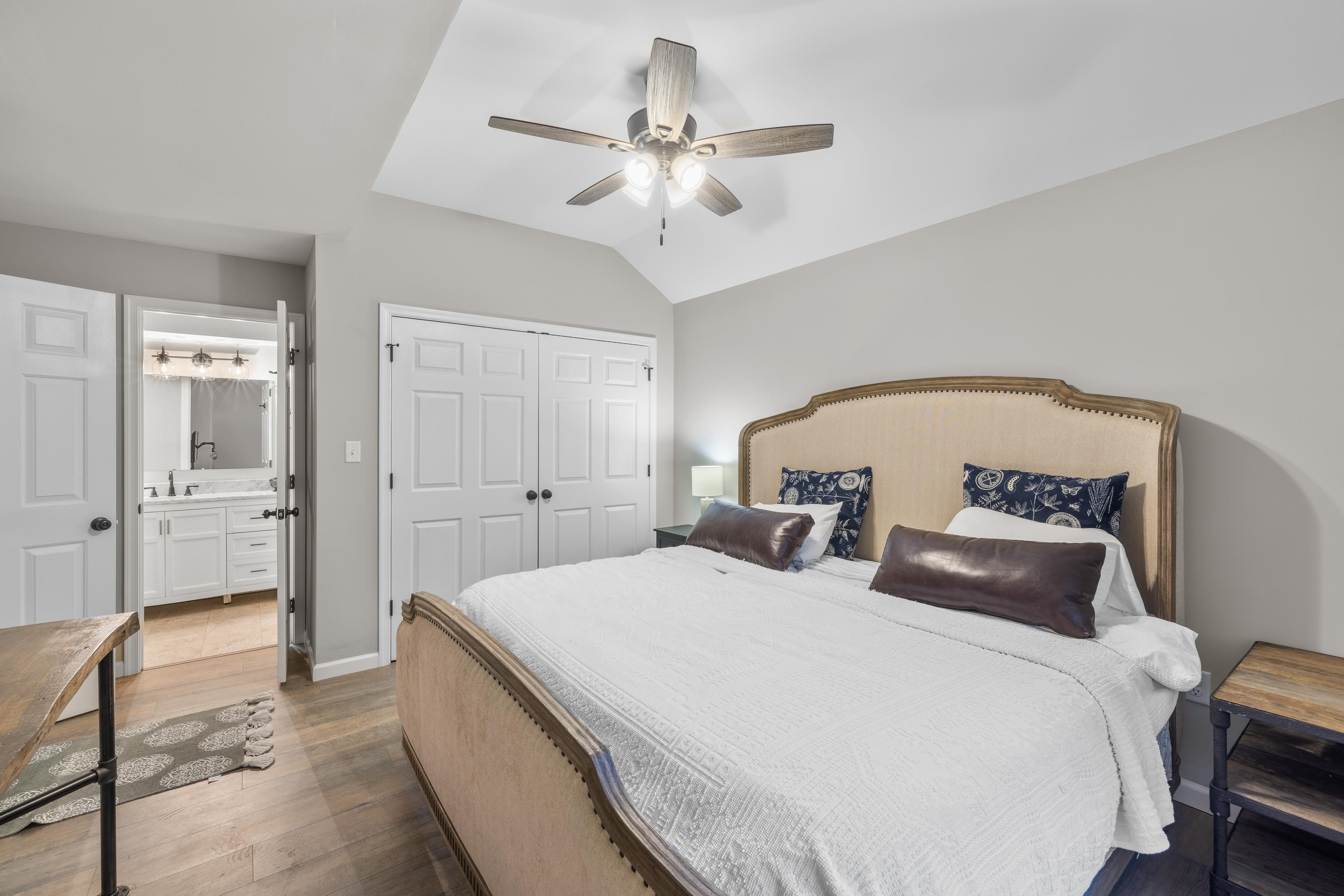 167 Raintree Road Verona, VA 24482 - Photo 27 of 75 a spacious bedroom with a bed and a chandelier