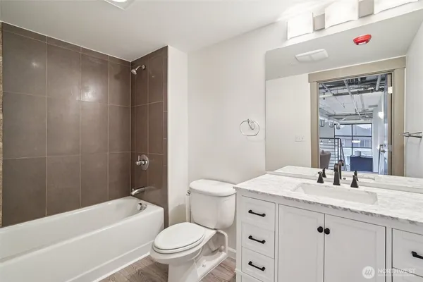a bathroom with a sink a toilet and a bathtub