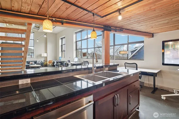 a kitchen with a sink and a large window