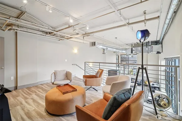 a bedroom with furniture and a chandelier