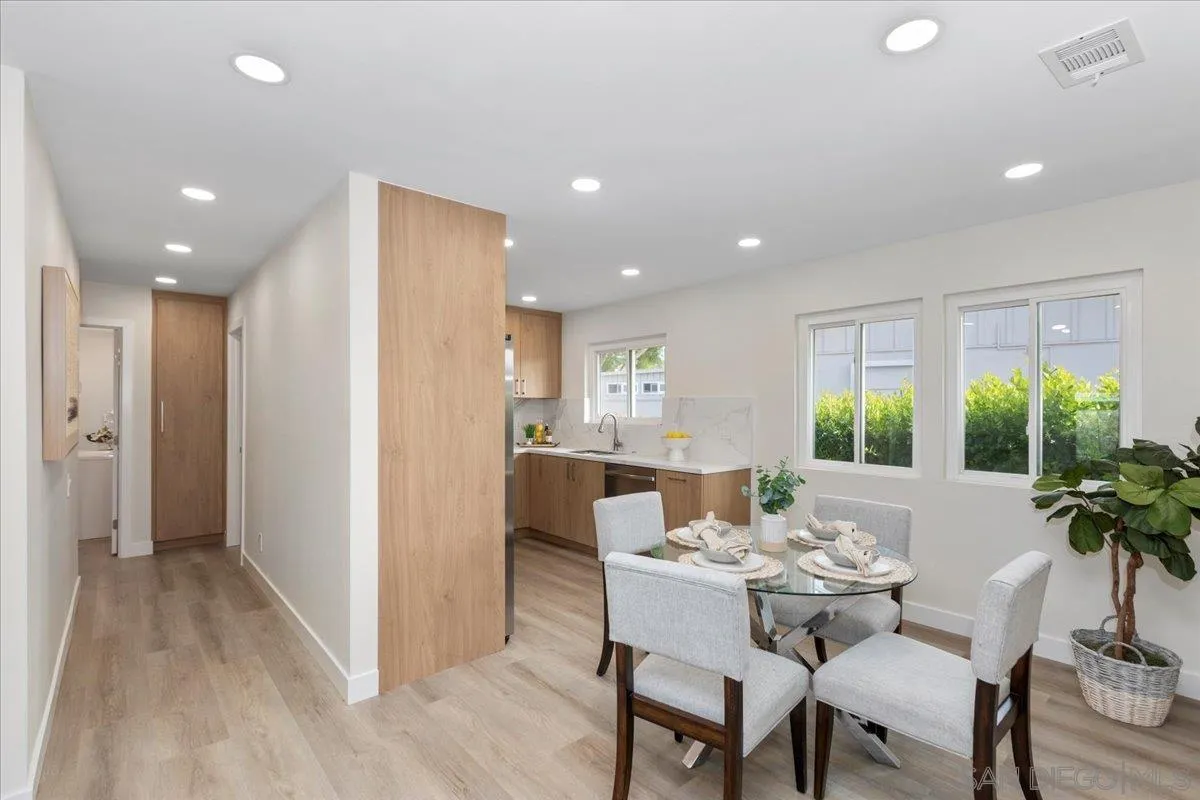 3615 Vista Bella, Unit 30 Oceanside, CA 92057 - Photo 11 of 38 a dining room with furniture window and wooden floor