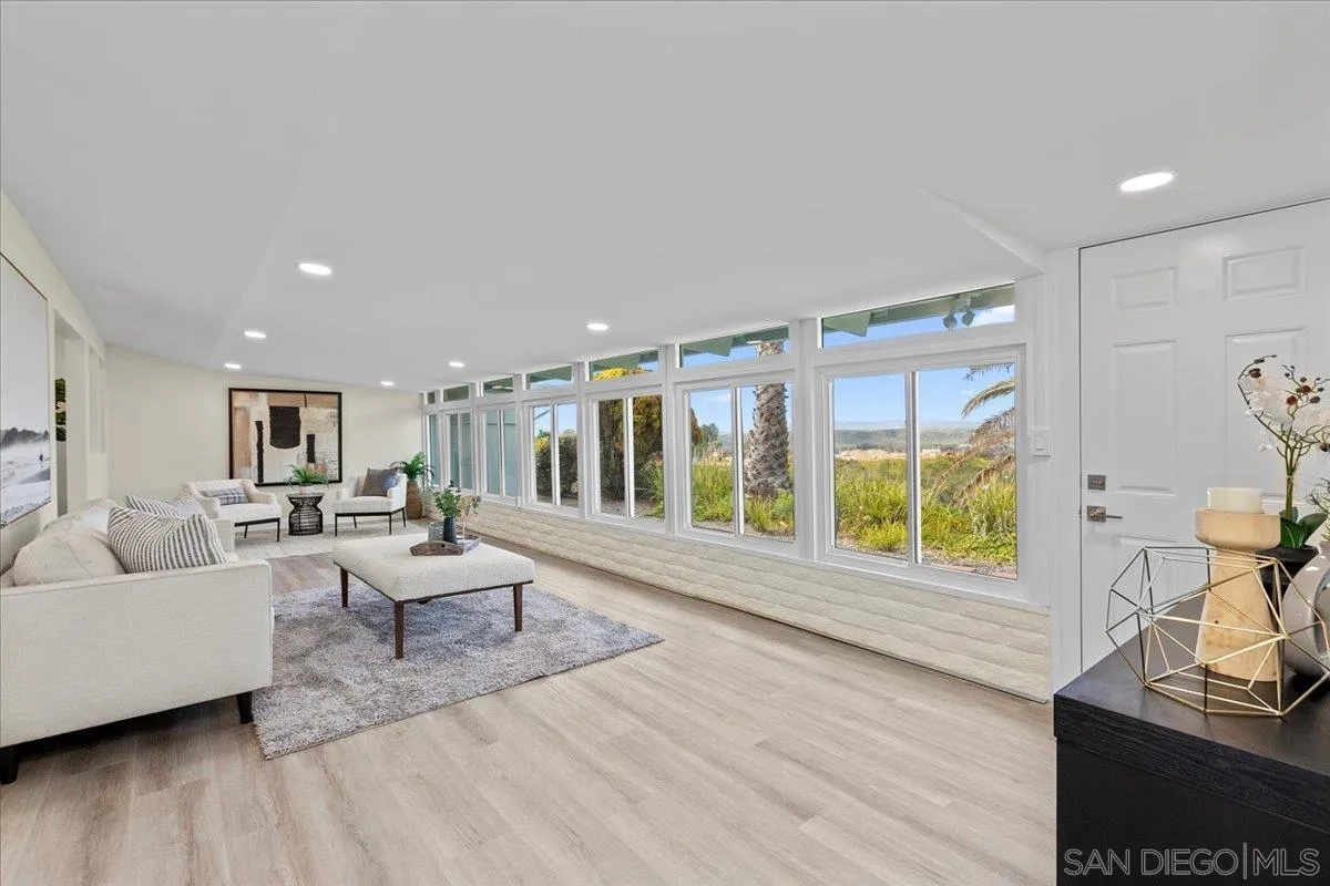 3615 Vista Bella, Unit 30 Oceanside, CA 92057 - Photo 18 of 38 a living room with furniture and a flat screen tv