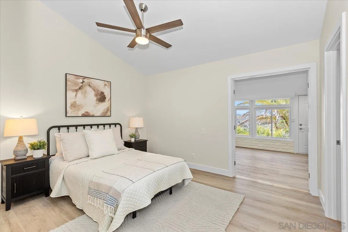 3615 Vista Bella, Unit 30 Oceanside, CA 92057 - Photo 19 of 38 a bedroom with a bed and a painting on the wall