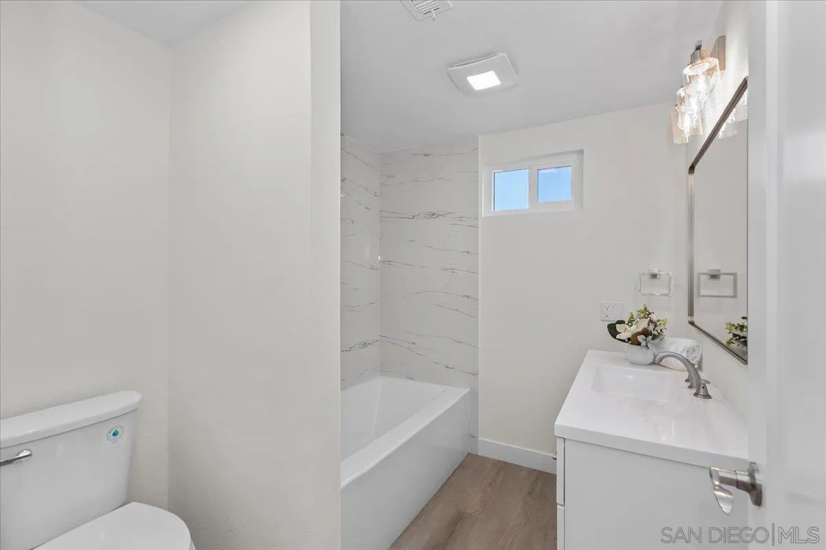 3615 Vista Bella, Unit 30 Oceanside, CA 92057 - Photo 26 of 38 a bathroom with a sink a toilet and bathtub