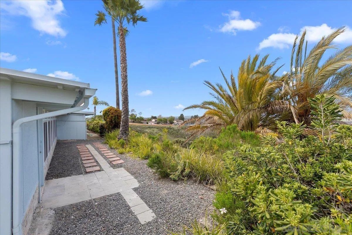 3615 Vista Bella, Unit 30 Oceanside, CA 92057 - Photo 30 of 38 a view of a pathway with a flower pot