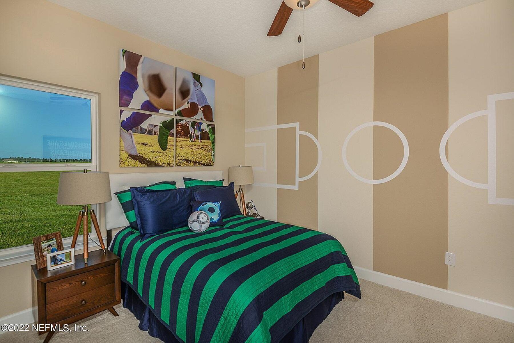 997 Silver Landing Drive, Unit 417 St. Augustine, FL 32092 - Photo 10 of 19 a bedroom with a bed and cupboard