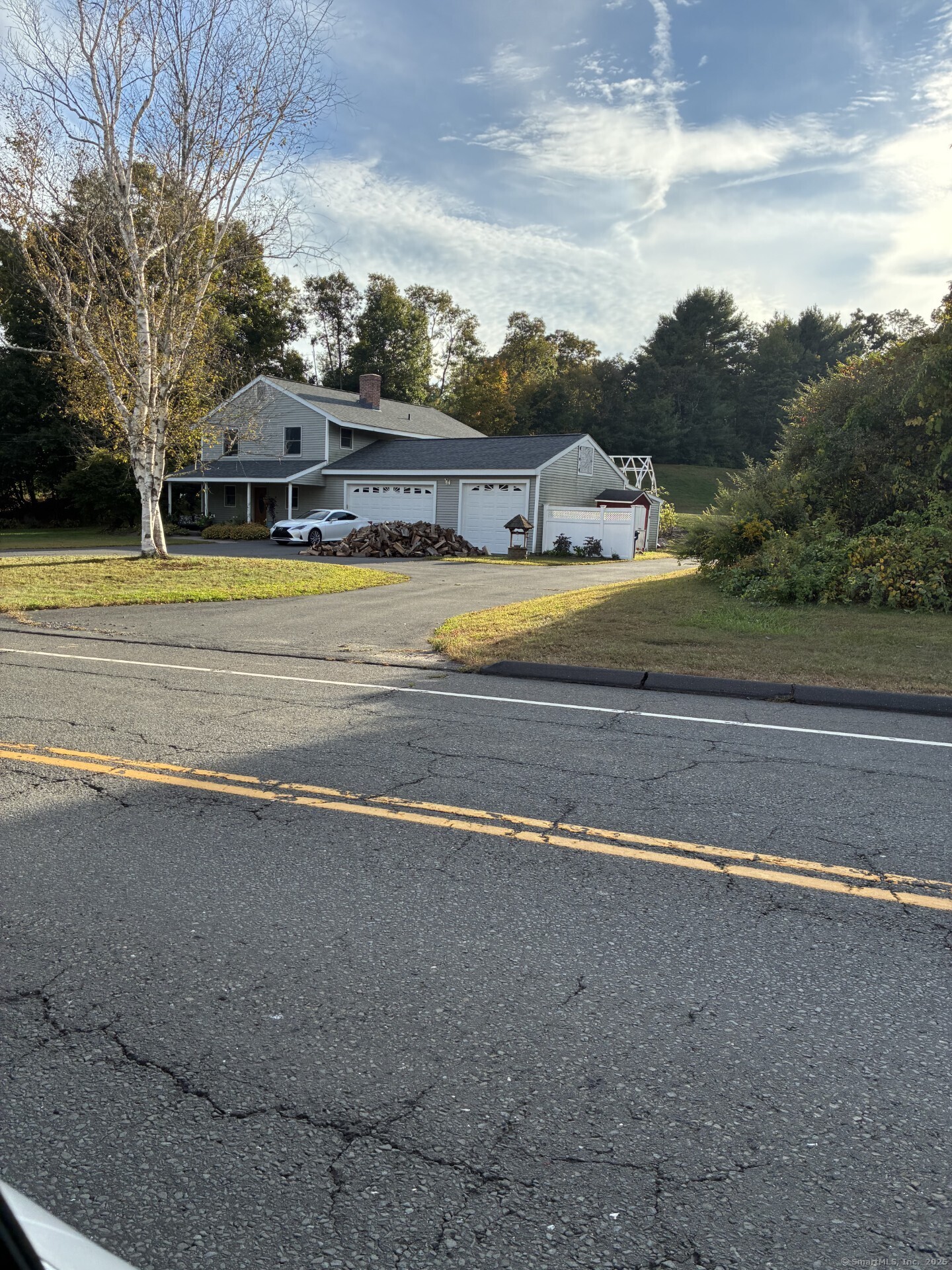 125 North Granby Road Granby, CT 06035 - Photo 2 of 25 a view of a big yard with palm trees