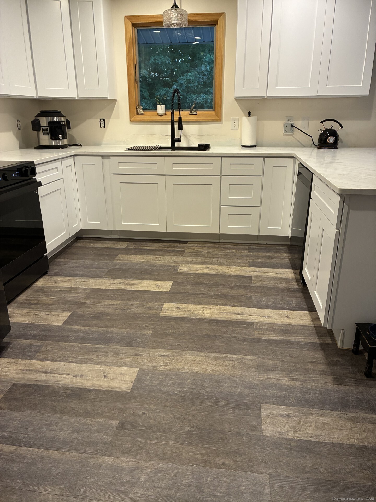 125 North Granby Road Granby, CT 06035 - Photo 8 of 25 a white kitchen with sink and cabinets