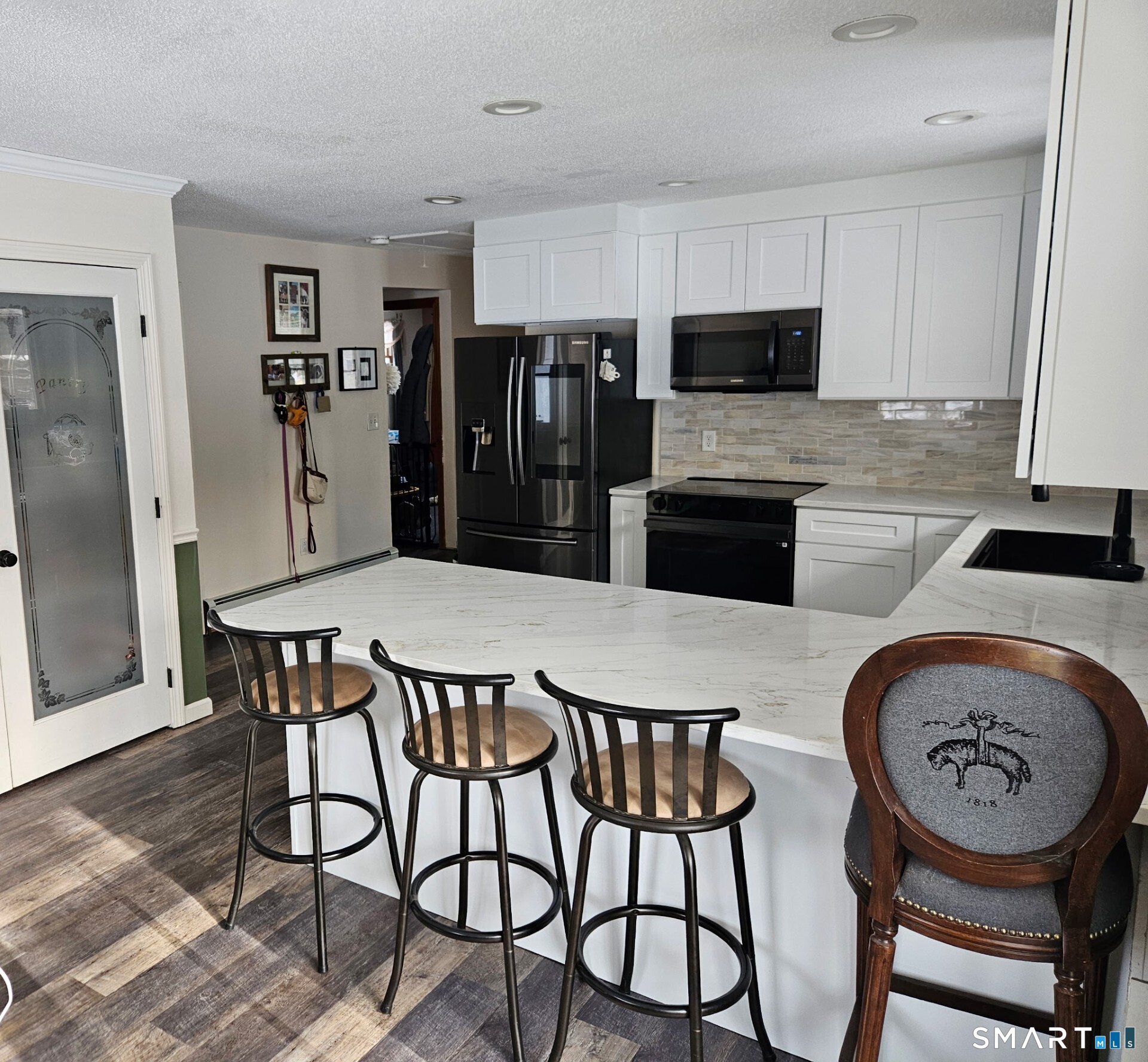 125 North Granby Road Granby, CT 06035 - Photo 10 of 25 a kitchen with stainless steel appliances granite countertop a dining table and chairs