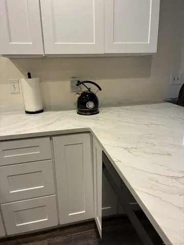 a kitchen with a sink and cabinets