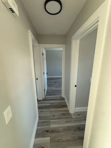 a view of entryway with wooden floor
