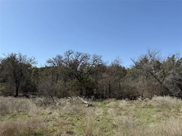 a view of a lake with houses in the back
