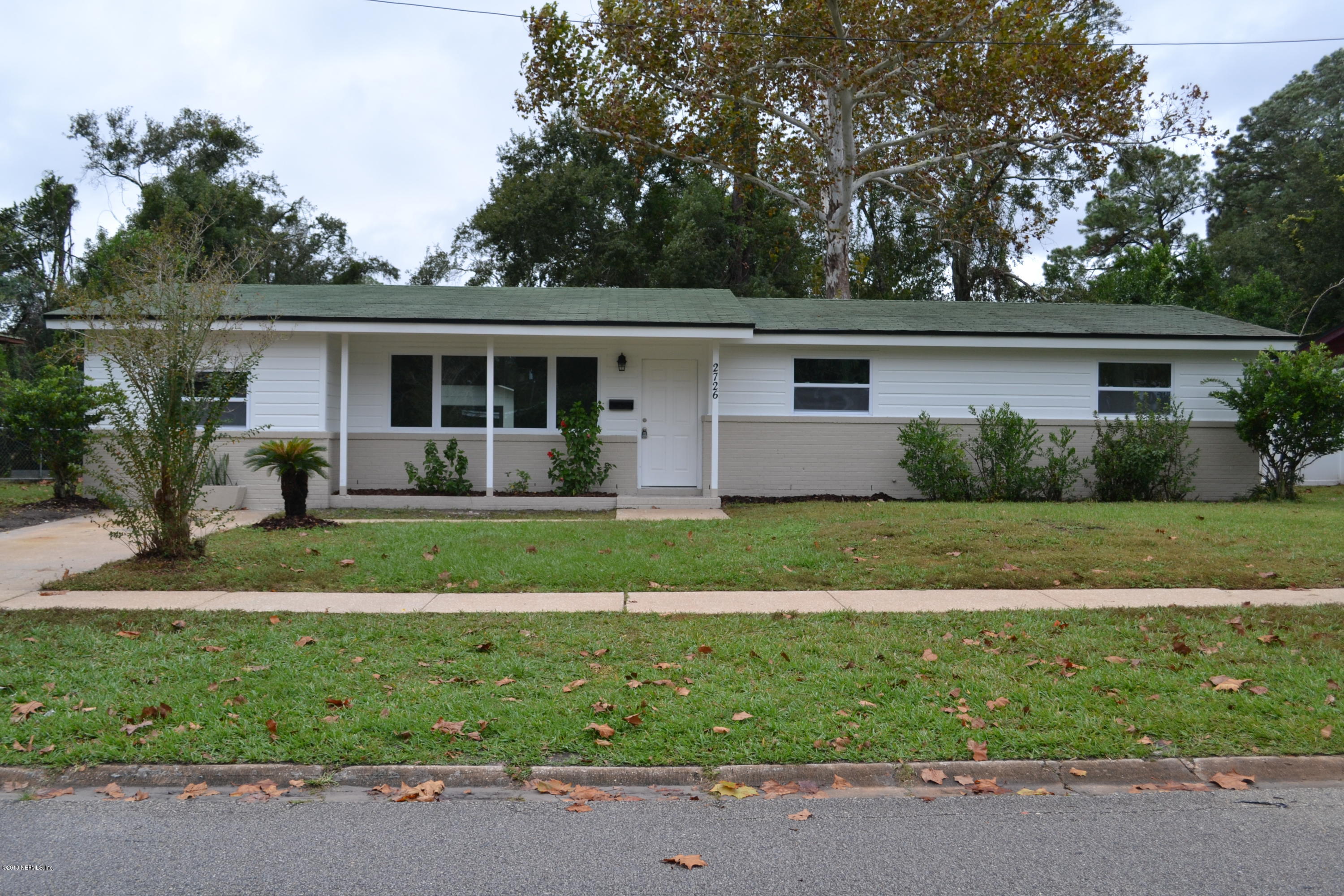 2726 Sam Road Jacksonville, FL 32216 - Photo 1 of 19 front view of house with a yard