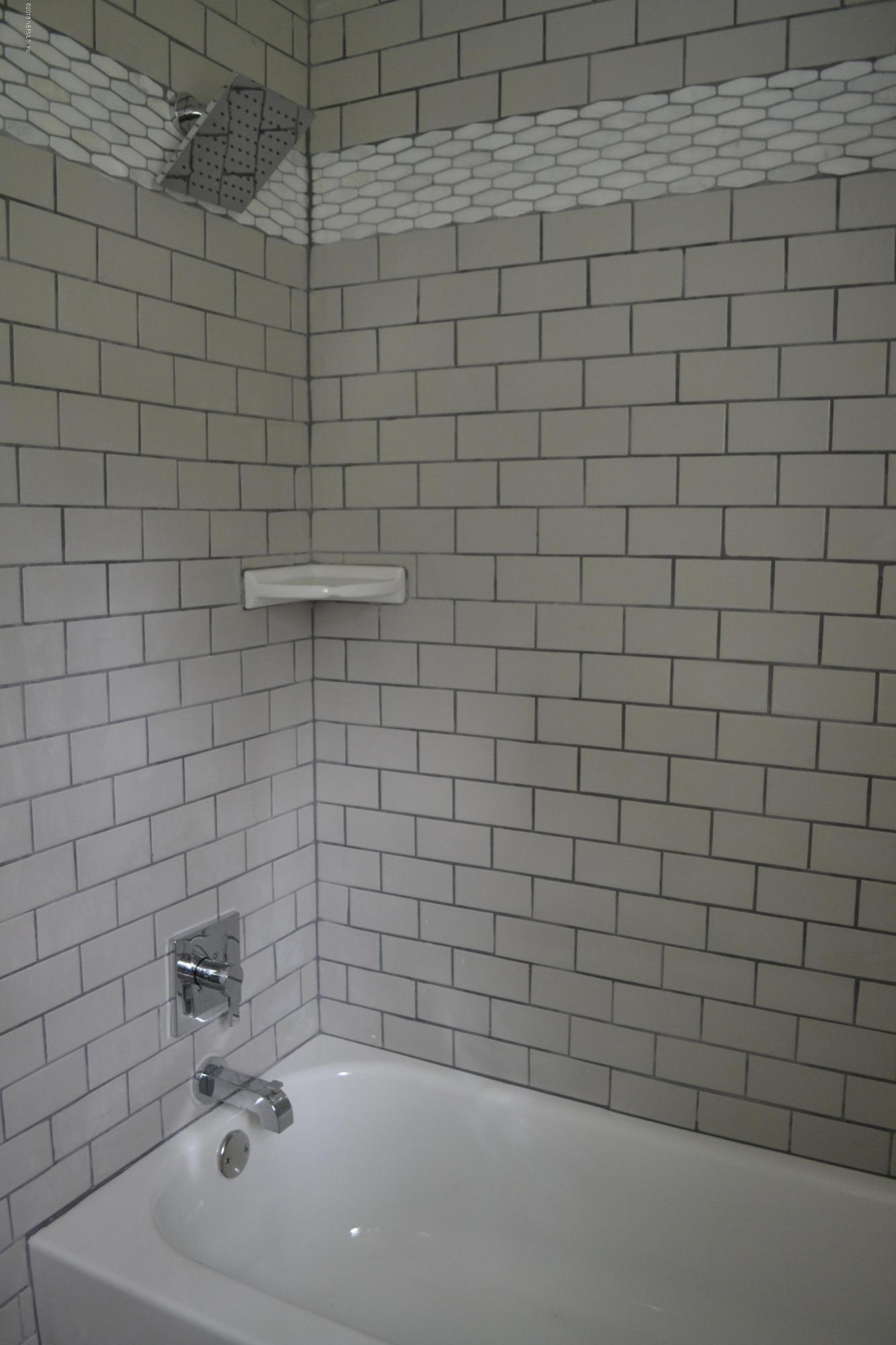 2726 Sam Road Jacksonville, FL 32216 - Photo 14 of 19 a bathroom with a white bathtub and a sink