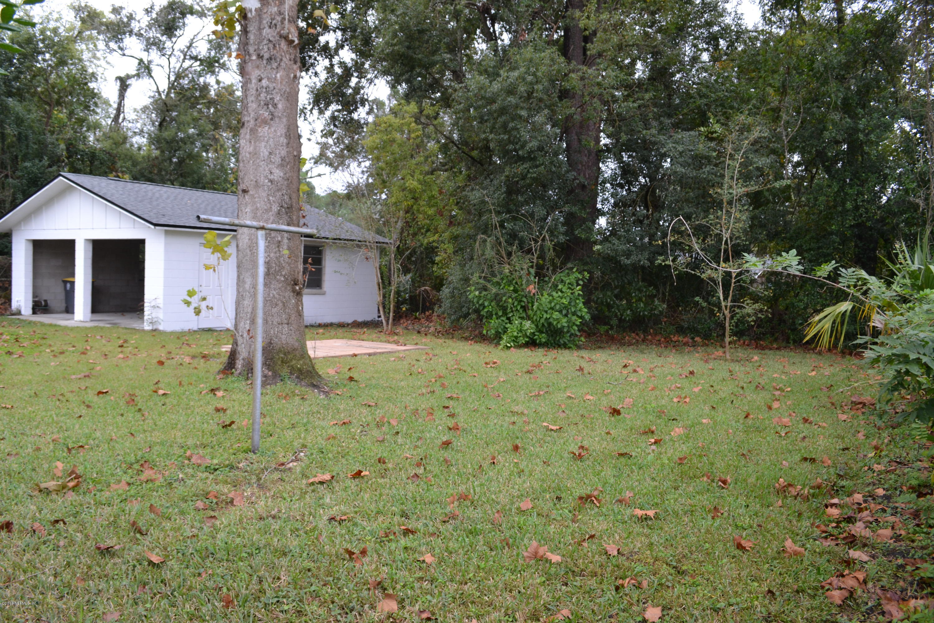 2726 Sam Road Jacksonville, FL 32216 - Photo 5 of 19 a view of a house with a yard