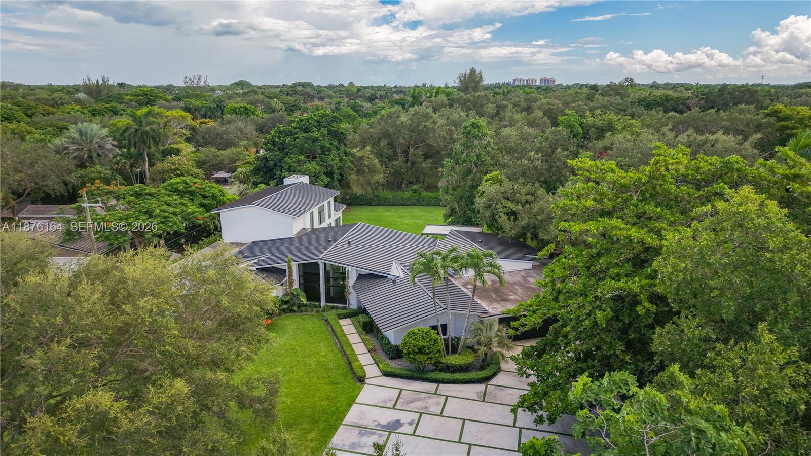 a view of a garden with a building in the background