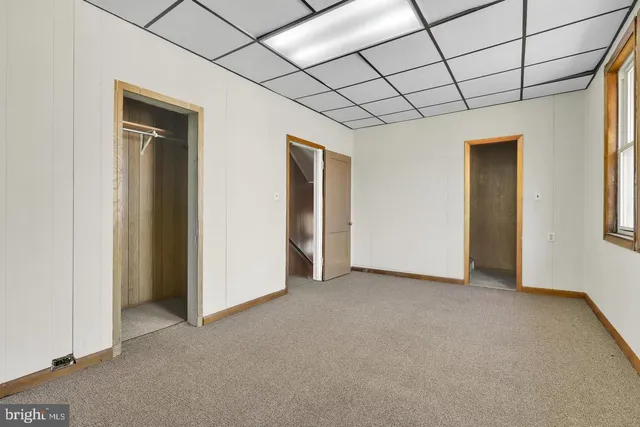 a view of empty room with windows