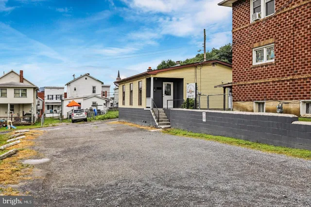 a swimming pool view with a outdoor seating