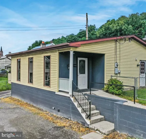 a front view of a house with a porch