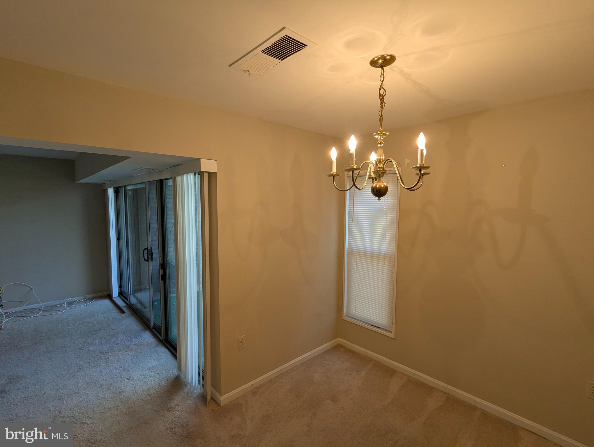 15 Canterbury Square, Unit 202 Alexandria, VA 22304 - Photo 5 of 14 a view of a chandelier in hallway
